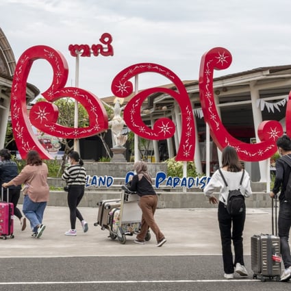 Tourists seen arriving at Ngurah Rai Airport in January 2022. Bali’s tourism industry is still witnessing a significant slowdown due to the pandemic. Photo: EPA-EFE