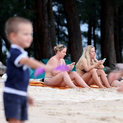 Russian tourists sit at the beach in Phuket, Thailand. File photo: Reuters