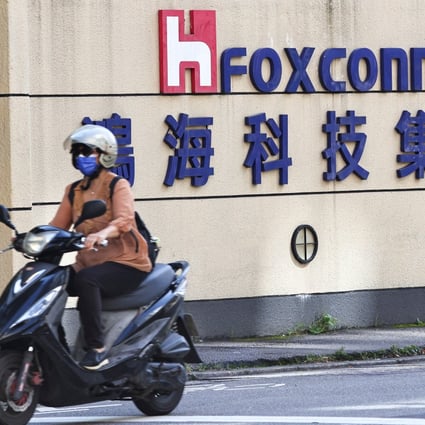A motorcycle speeds past Foxconn’s building in Taipei, Taiwan. Photo: Reuters