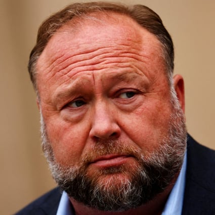 Infowars founder Alex Jones speaks to the media after appearing at his Sandy Hook defamation trial in Waterbury, Connecticut, in October. Photo: Reuters