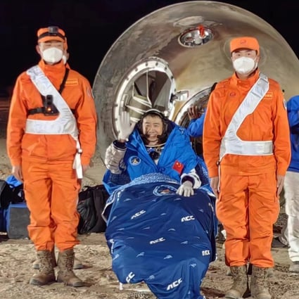 Astronaut Chen Dong celebrates after touching down with the Shenzhou-14 crew in Inner Mongolia on Sunday night. Photo: Xinhua