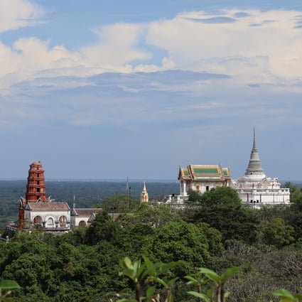 Khao Wang, or “palace hill”’ in Phetchaburi, Thailand, with its former royal retreat, rises above the flat surrounding plain. The city, on the site of a Khmer Empire outpost, has ruins of a temple from that era, and sacred caves. Photo: Thomas Bird