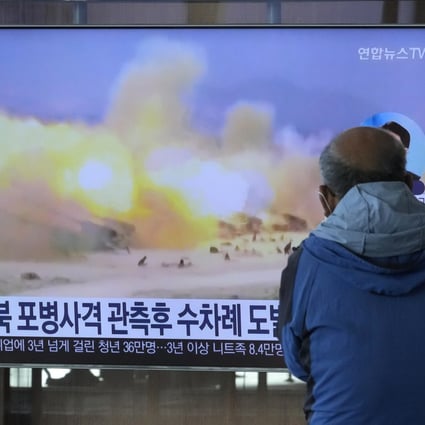 A TV screen shows a file image of North Korea’s military exercise during a news program at the Seoul Railway Station on October 19, 2022. South Korea’s military said North Korea fired about 130 suspected artillery rounds on Monday into the water near their western and eastern sea borders, the latest military action contributing to worsening relations between the neighbours. Photo: AP