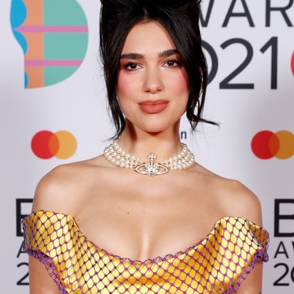 Dua Lipa wears a pearl necklace by Vivienne Westwood at the Brit Awards 2021 in London, England. Photo: JMEnternational for Brit Awards / Getty Images