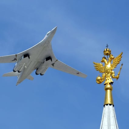 A Russian bomber flies over Moscow’s Red Square during a military parade in 2015. Photo: AFP