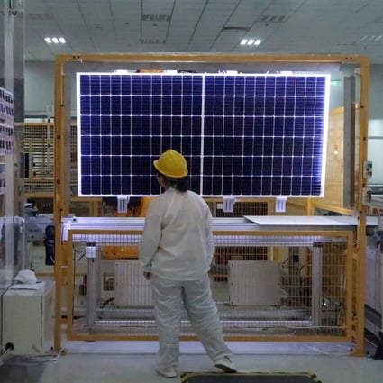A worker checks a solar module at the factory of Longi Green Technology in Xian, capital of northern China's Shaanxi province. Photo: Reuters