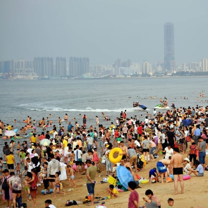 Tourists at a beach in the Hainan provincial capital of Haikou on May 1, 2019. Photo: Xinhua