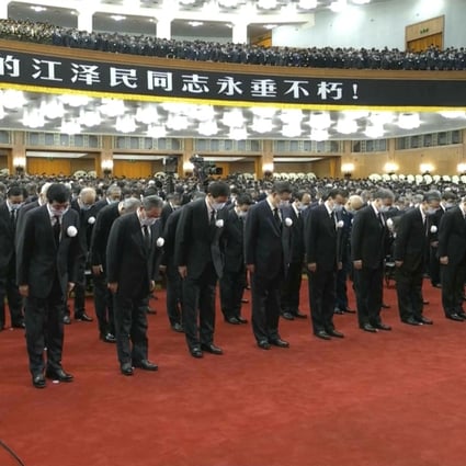 Xi Jinping leads other officials to bow during a formal memorial for the late former Chinese President Jiang Zemin at the Great Hall of the People in Beijing on Tuesday. Screengrab: CCTV via AP