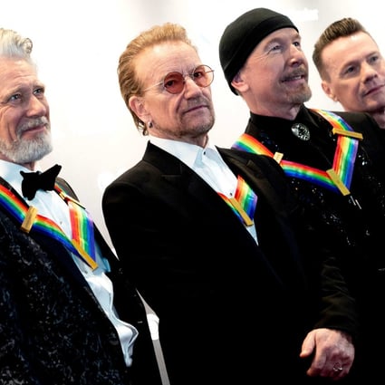 Adam Clayton, Bono, Larry Mullen Jr, and The Edge from U2 at the John F. Kennedy Center for the Performing Arts in Washington, DC, on December 4. Photo: AFP