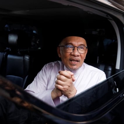 Malaysia’s Prime Minister Anwar Ibrahim meets supporters during his first public appearance. Photo: Reuters