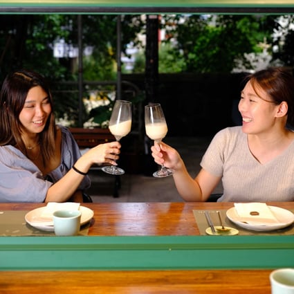 Customers enjoy makgeolli at Danji in Hong Kong. The reinvention of the Korean fermented rice drink by a new breed of artisan brewers has given it sophisticated appeal with the younger crowd. Photo: Danji
