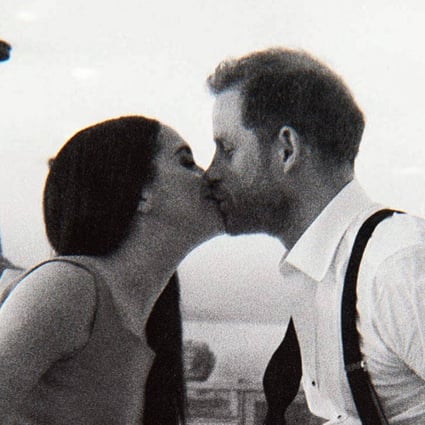 Harry and Meghan, The Duke and Duchess of Sussex, are seen kissing in a scene from their new documentary. Photo: Netflix via AFP