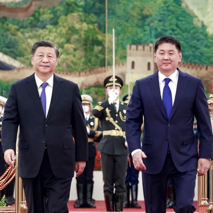 President Xi Jinping (left) walks alongside visiting Mongolian President Ukhnaagiin Khurelsukh before their talks in Beijing last month. Photo: Xinhua