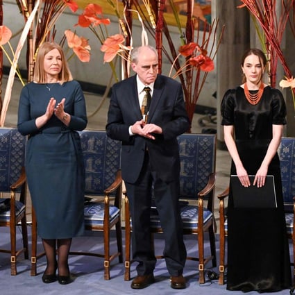 Natalia Pinchuk, left, on behalf of her husband, jailed Belarusian activist Ales Bialiatski, and chairman Yan Rachinsky on behalf of Russian human rights organisation Memorial, centre, applaud after Nobel Peace Prize 2022 winner and Head of the Ukrainian Centre for Civil Liberties, Oleksandra Matviichuk, right, delivered her speech during the awards ceremony in Norway. Photo: AFP