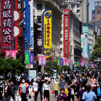 People walk along Nanjing Pedestrian Road, a main shopping area in Shanghai in May 2021. Photo: Reuters