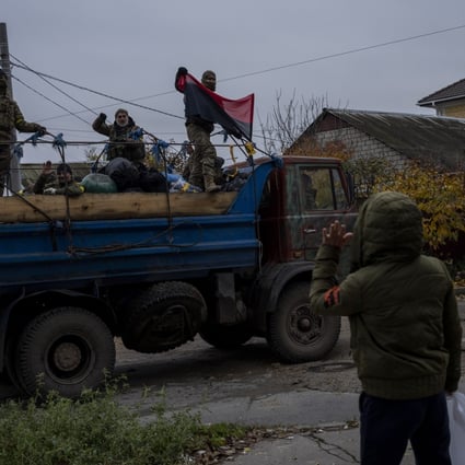 A resident waves to Ukrainian security forces in the Kherson area, southern Ukraine. Photo: AP/File