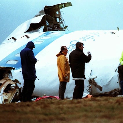 Crash investigators inspect the nose section of the crashed Pan Am flight 103 in a field near Lockerbie, Scotland in1988. Photo: AP