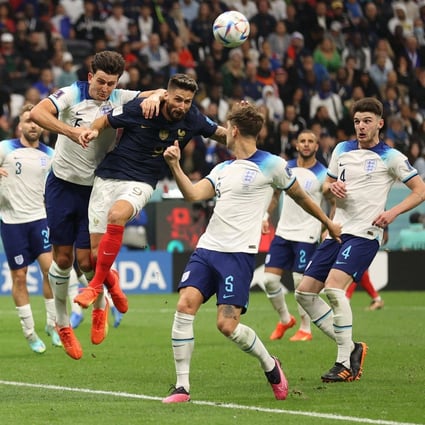 Olivier Giroud scores his team’s second goal past England’s defender during the World Cup quarter-final football match. Photo: AFP