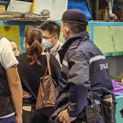 Police and other officials are seen in an operation at Aberdeen Wholesale Fish Market on early Sunday. Photo: Hong Kong Police