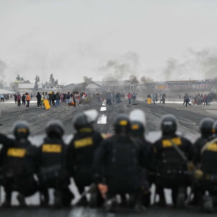 Demonstrators invade the runway of the international airport in Arequipa, which is a gateway to some of Peru’s tourist attractions. Photo: AFP