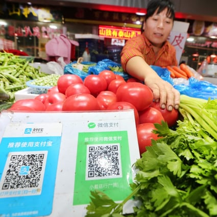 QR codes of Tencent’s WeChat Pay and Ant Group’s Alipay at a wet market in eastern China’s Jiangsu province. Photo:  ImagineChina via AFP