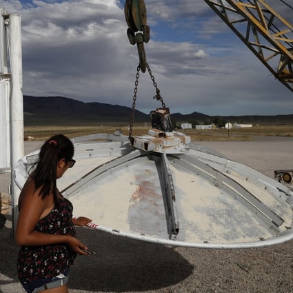 A woman looks at a UFO display outside of the Little A’Le’Inn, in Rachel, Nevada, the closest town to Area 51, in July 2019. Photo: AP