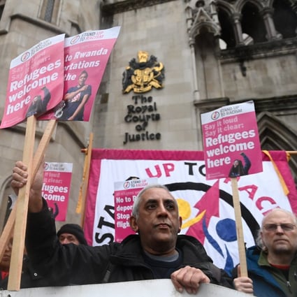 Members of the Stand up to Racism protest group demonstrate against the deportations of Refugees to Rwanda at the High Court in London on December 19. Photo:  EPA-EFE