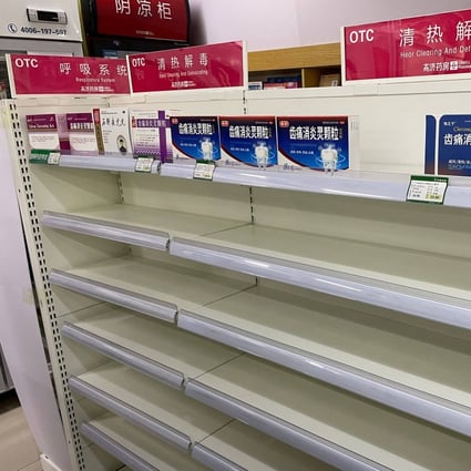 Almost empty shelves at a pharmacy in Beijing as Covid-19 infections surge. Photo: AFP