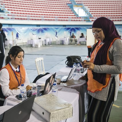 Members of the independent higher authority for elections count votes one day after the parliamentary elections in Tunis, Tunisia on Sunday. Photo: AP