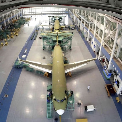 China’s domestically made ARJ21 jetliner is seen being manufactured in Shanghai. Photo: AP