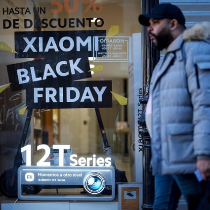 Promotional signage for Black Friday in the window of a Xiaomi store in Madrid, Spain, Nov. 25, 2022. Photo: Bloomberg