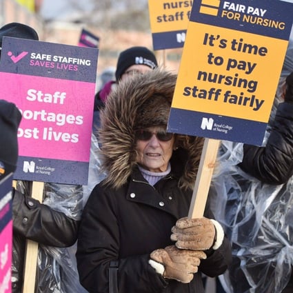 Protesters hold placards on a picket line during a strike by NHS nursing staff outside Alder Hey Children’s Hospital in Liverpool, UK on Tuesday. Photo: Bloomberg
