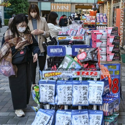 An outdoor display for items outside a drugstore chain store in downtown Tokyo on November 18, 2022. Photo: AFP