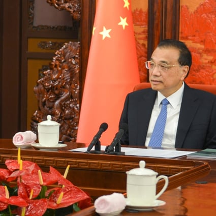 Premier Li Keqiang (right) meets John Lee in Beijing. Photo: Handout