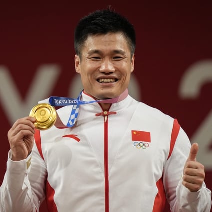 China’s Lyu Xiaojun celebrates after winning the gold medal in the men’s 81kg weightlifting event the Tokyo Olympics. Photo: AP