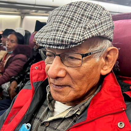 French serial killer Charles Sobhraj sits on a flight departing from Kathmandu to France. Photo: AFP