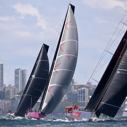 Wild Oats (right) leads Stefan Racing and Willow (left) during the 2022 SOLAS Big Boat Challenge on Sydney Harbour. Photo: EPA-EFE