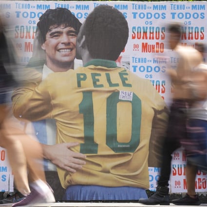 People walks past a mural of Brazilian soccer legend Pele. Photo: AP