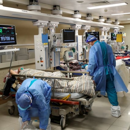 Medical workers attend to patients at the intensive care unit at Beijing Chaoyang hospital on Tuesday as the country struggles with a tidal wave of Covid-19 cases. Photo: Reuters