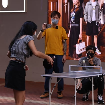 Young people play table tennis on a busy street in Mong Kok on April 10. Hong Kong recently announced its first youth blueprint with a goal to “provide an enabling environment for young people to unleash their full potential”. Photo: Nora Tam