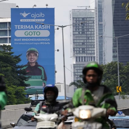 Motorcyclists pass a billboard advertising GoTo, a merging of Indonesian tech company Gojek and e-commerce pioneer Tokopedia, in Jakarta, Indonesia, on April 8. Photo: Bloomberg