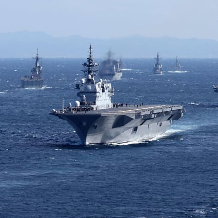 Military vessels including Japan’s Maritime Self-Defence Force’s largest carrier Izumo (centre) sailing in Sagami Bay during the International Fleet Review on November 6. Japan has announced on December 16 its biggest defence overhaul in decades, raising spending, reshaping its military command and acquiring new missiles to tackle the threat from China. Photo: AFP