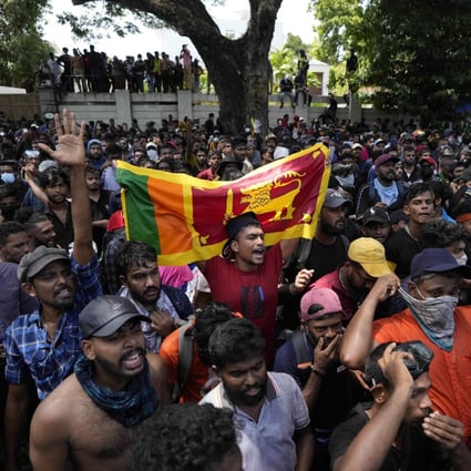 Protesters storm the office compound of Sri Lanka’s then-prime minister Ranil Wickremesinghe in July demanding he resign amid the country’s economic crisis. Wickremesinghe is now president. Photo: AP