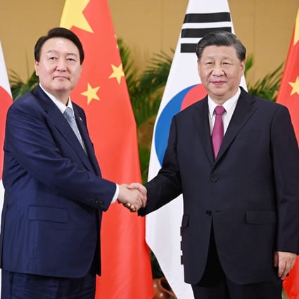 Chinese President Xi Jinping shakes hands with South Korean President Yoon Suk-yeol when they met on the sidelines of last month’s G20 summit in Indonesia. Photo: Xinhua