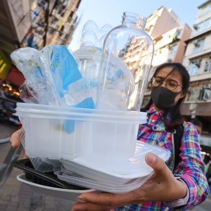 Sham Shui Po resident Yan Yuen carries waste to the nearest recycling station. Photo: May Tse