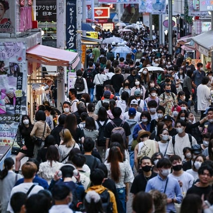 People walk down Takeshita Street in the popular Harajuku area of Tokyo. Japan has reintroduced negative Covid-19 tests for Chinese travellers as mandatory conditions of entry. Photo: AFP