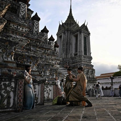 Tourists visit the Wat Arun Buddhist temple in Bangkok, Thailand. Photo: AFP