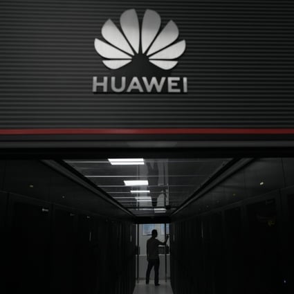 A technician at the entrance to a Huawei 5G data server centre at Guangdong Second Provincial General Hospital in Guangzhou, China. Photo: AP