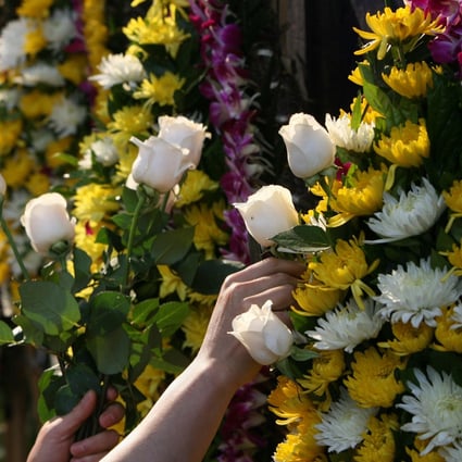 The practice of placing heavily fragranced flowers near coffins to mask the smell of decomposition has morphed into superstition. Photo: SCMP