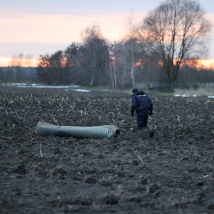 An investigator walks near what Belarus’ defence ministry said was part of a Ukrainian S-300 missile downed by Belarusian air defences near the village of Harbacha in the Grodno region of Belarus on Thursday. Photo:
Vadzim Yakubionak / BelTA / Handout via Reuters